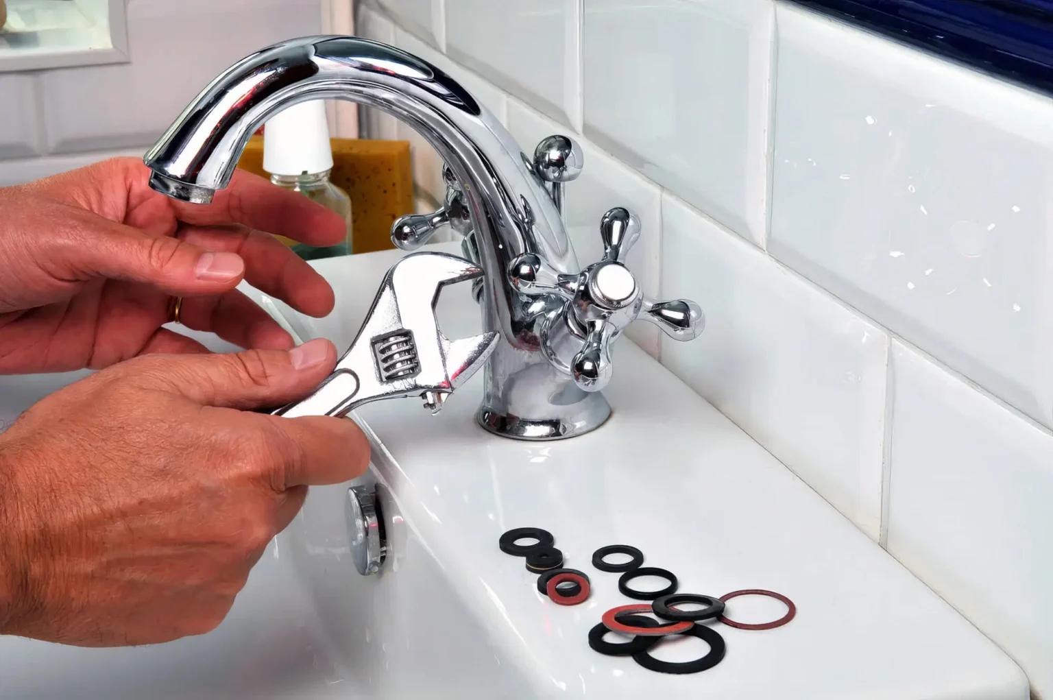 Plumber maintaining a bathroom faucet in Santa Paula