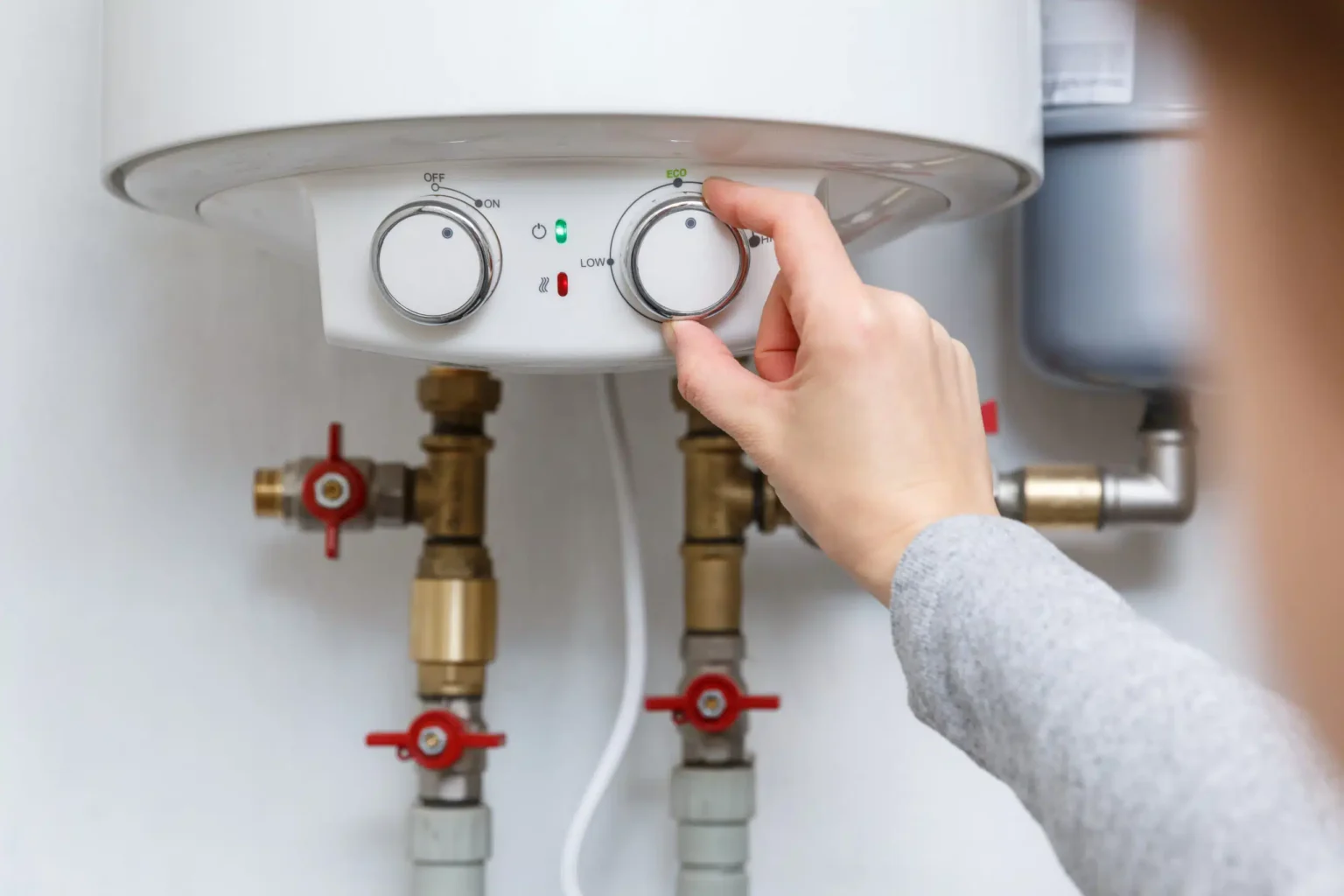 Technician adjusting a water heater in Santa Paula