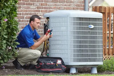 Outdoor AC Unit Inspection Santa Paula HVAC technician inspecting an outdoor AC unit in Santa Paula